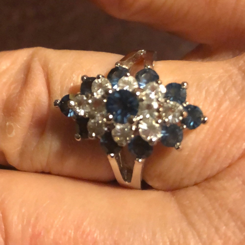 14KT GE ESPO marked silver tone ring with cz and blue sapphire colored stones.